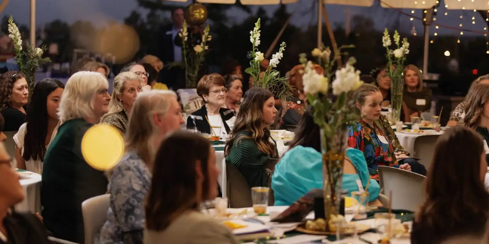 women of vision dinner under tent